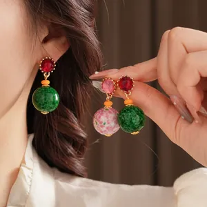 Vintage court style drop earrings with colorful spotted ceramic beads and gold accents