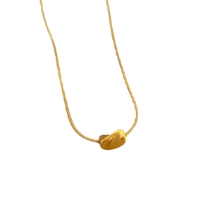 Minimalist gold titanium steel necklace featuring a twisted bean pendant on a snake chain