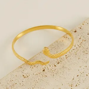 Luxurious 18k gold plated snake-shaped open bangle featuring detailed scale textures