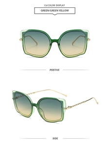 Detail of vintage cat-eye sunglasses with green lenses and twisted metal temples