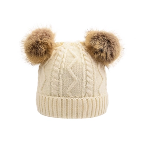 Winter chunky knit beanie for women featuring double brown faux fur pom-poms in beige