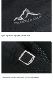 Close-up of the metal buckle and white mountain logo on a black mesh outdoor cap