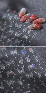 Detailed macro view of laser butterfly nail art stickers with iridescent glitter effect