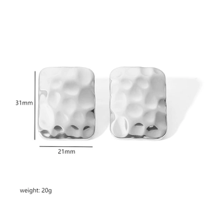 Detail of silver rectangle earrings with hammered texture and 31mm size dimensions
