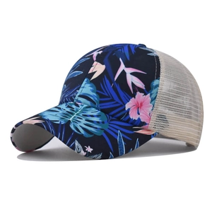 Detail of floral baseball cap featuring tropical hibiscus prints and breathable mesh back