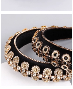 Detail of luxury Baroque velvet headbands with gold plating and sparkling crystal flowers