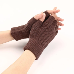 Close-up of deep brown cable knit fingerless gloves with ribbed cuffs and soft texture