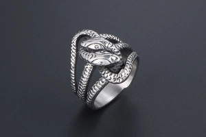 Macro view of double-headed snake ring with detailed silver scales in punk style