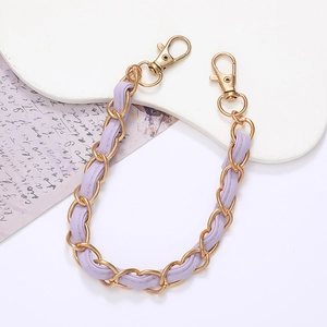 Short golden metal chain woven with purple leather featuring two lobster clasps