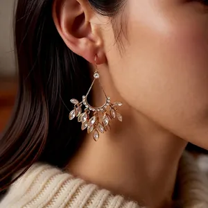 18k gold plated teardrop tassel earrings with sparkling cubic zirconia on model