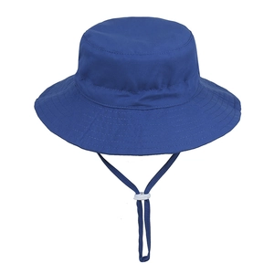 Close-up of blue children sun hat showing white adjustable windproof cord and stitching