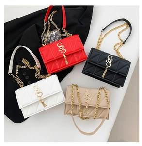 Flat lay of quilted PU leather chain bags in red, black, white, and beige colors