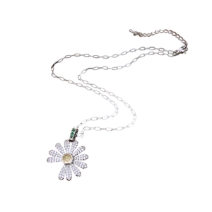 French style silver daisy pendant necklace with sparkling white diamonds and yellow gems