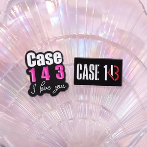 Case 143 heart enamel pin set with Stray Kids inspired design on shell background