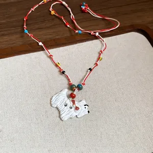 Colorful beaded dog necklace with Westie pendant on red white braided cord