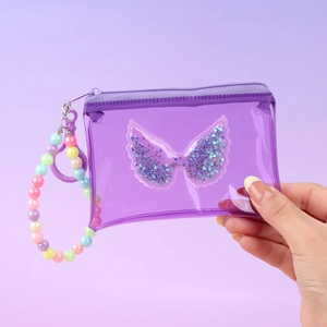 Detail of purple transparent PVC coin purse with glitter wing sand and colorful beads