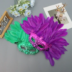 Luxurious emerald green and magenta feather masks with intricate plating for Halloween parties