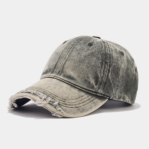 Vintage washed denim baseball cap with distressed rip details and a curved brim