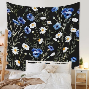 Artistic floral tapestry with blue cornflowers and white daisies on a black background