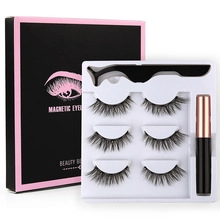 Magnetic eyelash kit with three pairs of 3D lashes, eyeliner, and tweezers on white backdrop