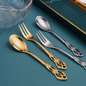 European vintage embossed stainless steel dessert spoon and fork set in gold and silver