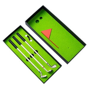 Mini golf club pen gift set with three metal pens, two balls, and flag in a green turf box