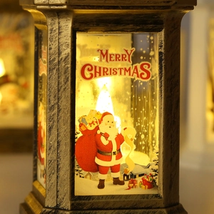 Close-up of vintage bronze Christmas lantern with warm LED light and festive engraving