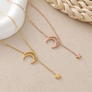 Minimalist moon and star pendant necklace in gold and rose gold stainless steel finishes