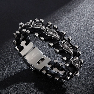 Macro shot of 316L stainless steel clasp and black braided leather strap on a biker bracelet