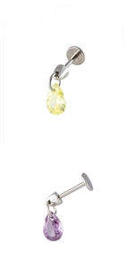 Macro detail of teardrop zirconia pendants in light yellow and purple on silver studs