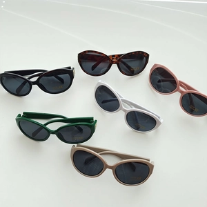 Oval UV400 kids sunglasses in black, white, pink and khaki colors on a plain background