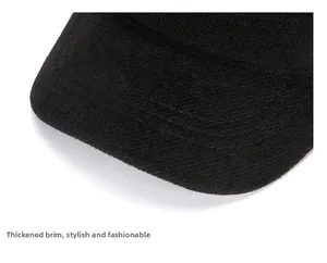 Detail of reinforced stitching and thickened brim on black wool elderly flat cap