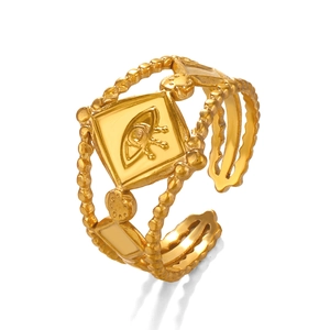 Adjustable gold stainless steel evil eye geometric ring with a textured triple band