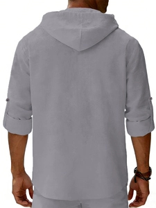 Detail view of men's linen hoodie shirt back showing rolled sleeve with button tab