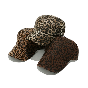 Three leopard print baseball caps for women in brown and beige colors with curved brims