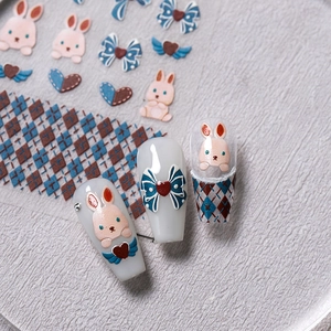5D embossed nail stickers featuring pink rabbits, blue bows, and brown plaid patterns