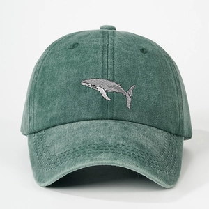 Vintage dark green washed cotton baseball cap featuring embroidered whale design