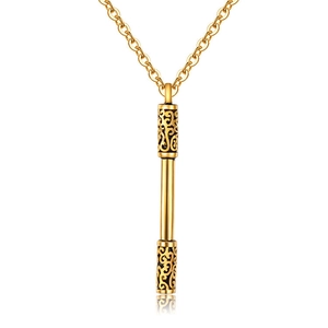 Close-up of golden pillar pendant with intricate hollow cloud patterns and polished finish