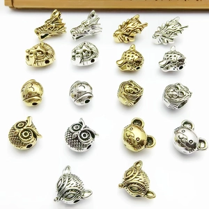 Assorted gold and silver metal animal head spacer beads for DIY jewelry making and bracelets