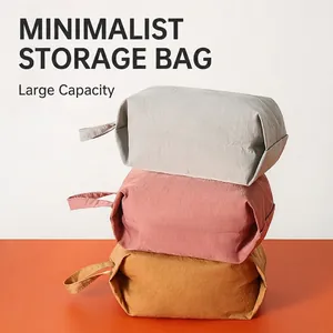 Stack of three colorful waterproof travel organizer bags with durable fabric handles