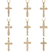Detailed grid view of nine different gold-plated cross pendants set with white zircons
