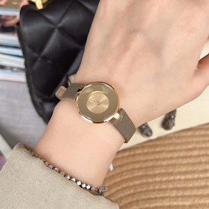 Elegant women's watch with gold round case, Roman dial, and taupe leather strap