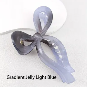 Macro shot of 13cm gradient jelly blue bow hair claw clip with smooth polished finish