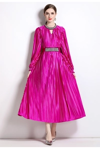 Close-up of luxury beaded neckline and rhinestone waist on magenta pleated dress