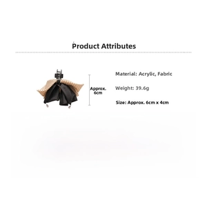 Détail de la pince à cheveux en acrylique avec nœud en tissu et mesures de taille