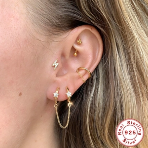 S925 sterling silver gold ear cuff and star earrings set worn by a model