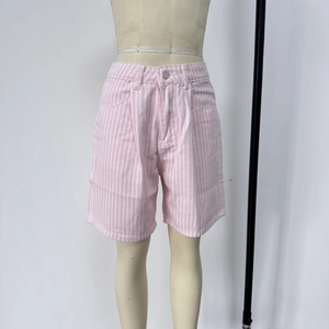 Detail of pink and white striped high-waisted denim shorts with metal button and zip fly