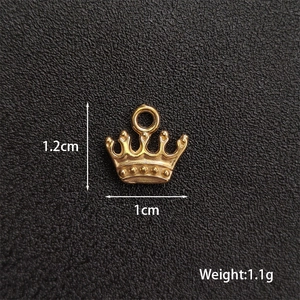 Detail of vintage gold crown pendant with dimensions 1.2cm by 1cm for DIY jewelry making