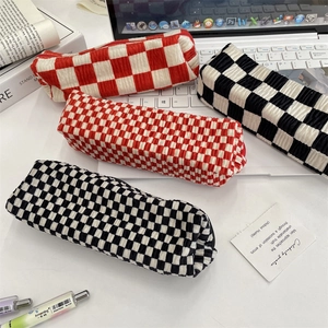 Checkered seersucker makeup bag and stationery pouch in red and black patterns