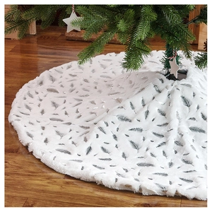 Detail of white plush Christmas tree skirt featuring shiny silver feather print patterns